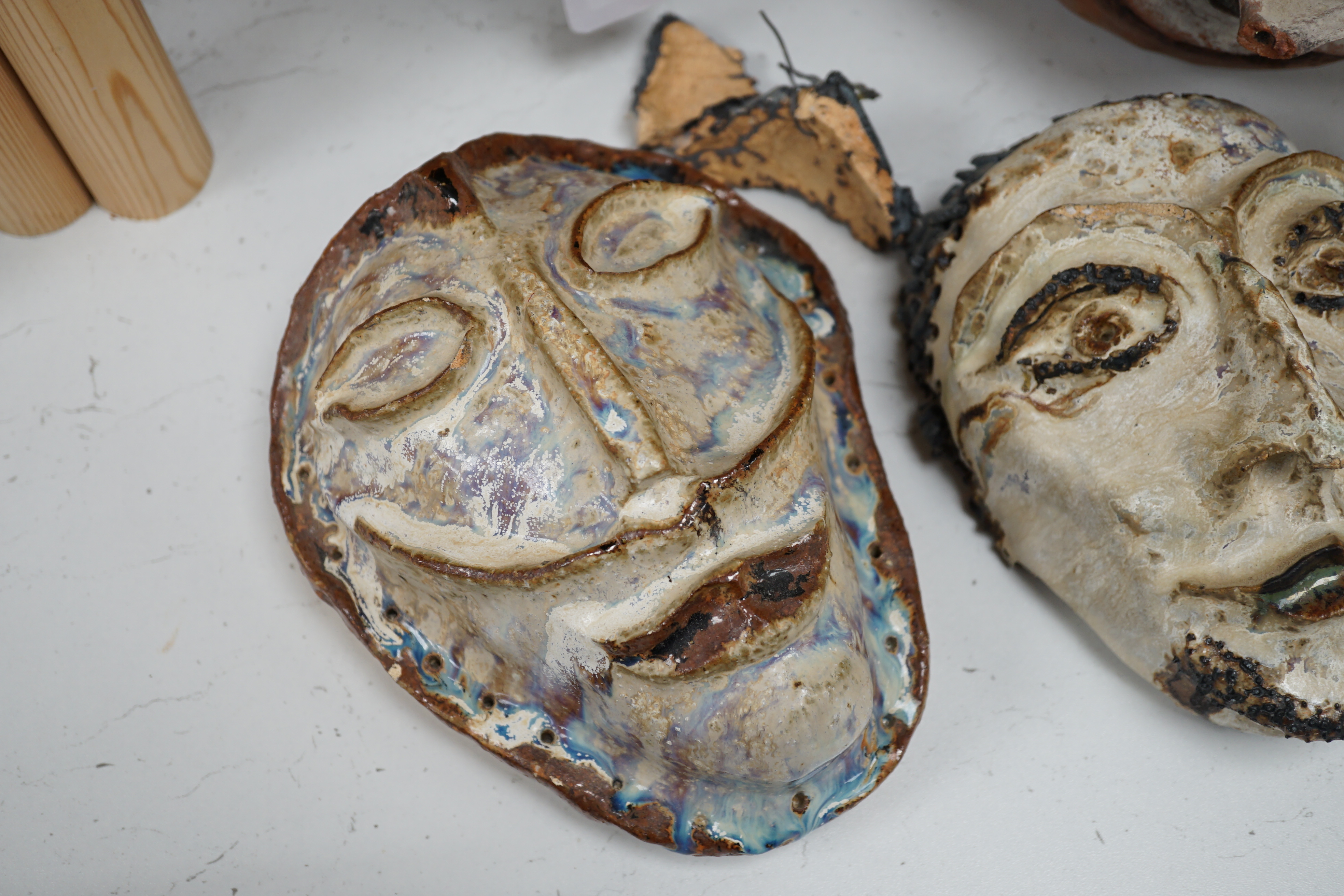 Two Papa New Guinea pottery face masks and two cooking pots